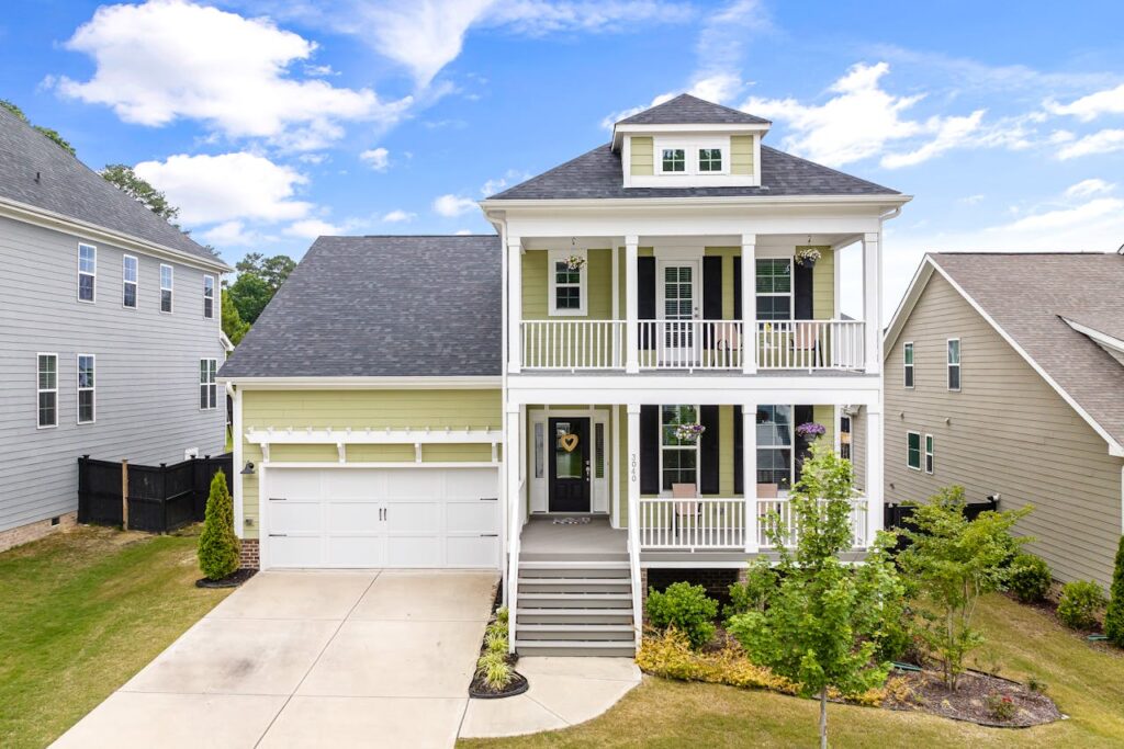 Two-story suburban house with a double porch design, ideal family living in Wake Forest, NC.